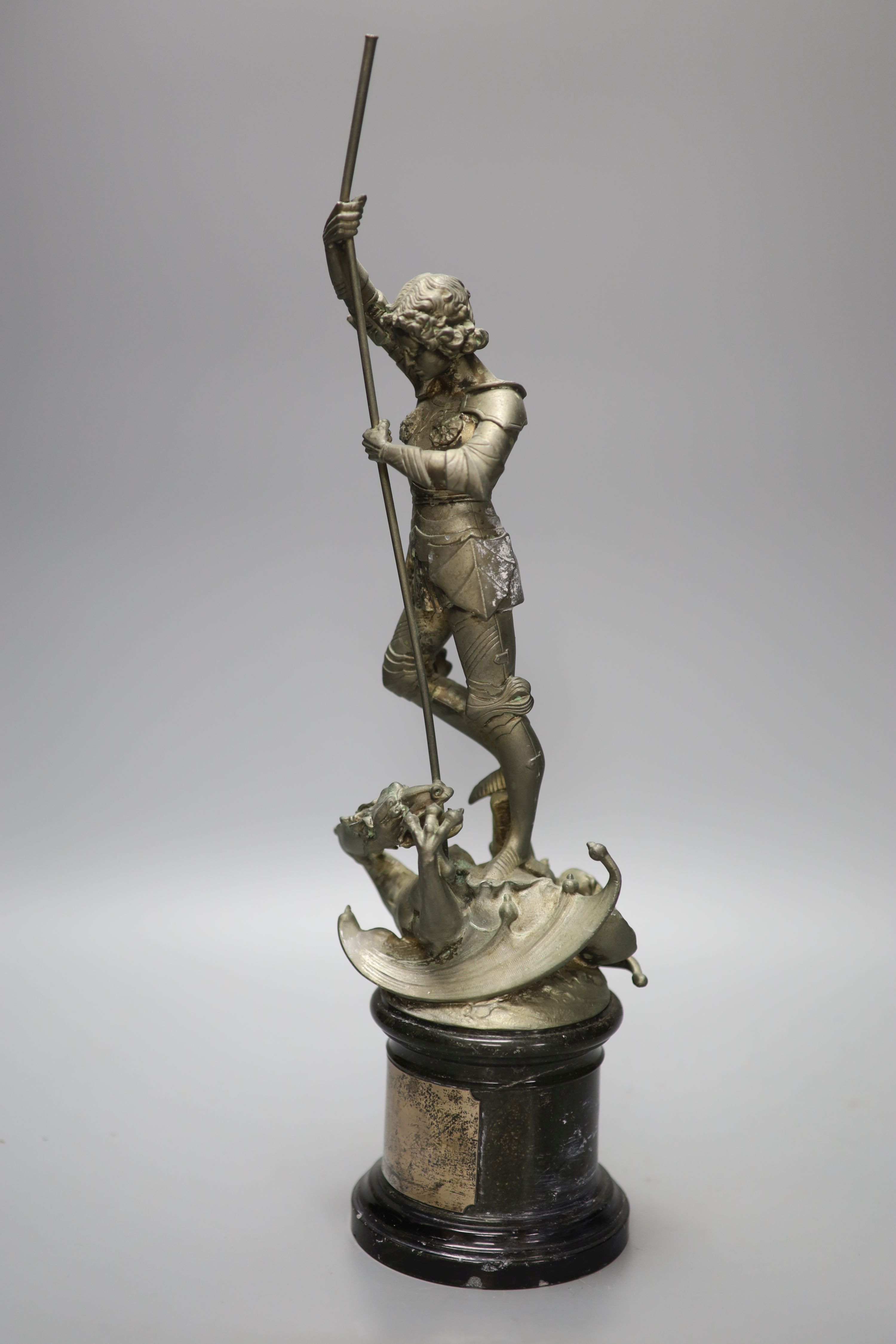 A spelter figure of St George and the Dragon, on turned marble base with vacant silver cartouche, height 41cm